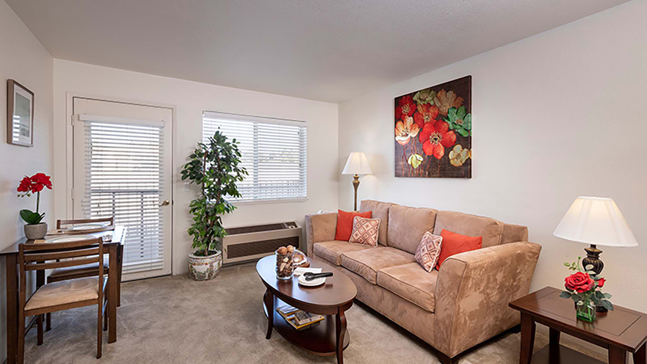 Independent living apartment in Santa Clara, CA with balcony, natural lighting and sofa.