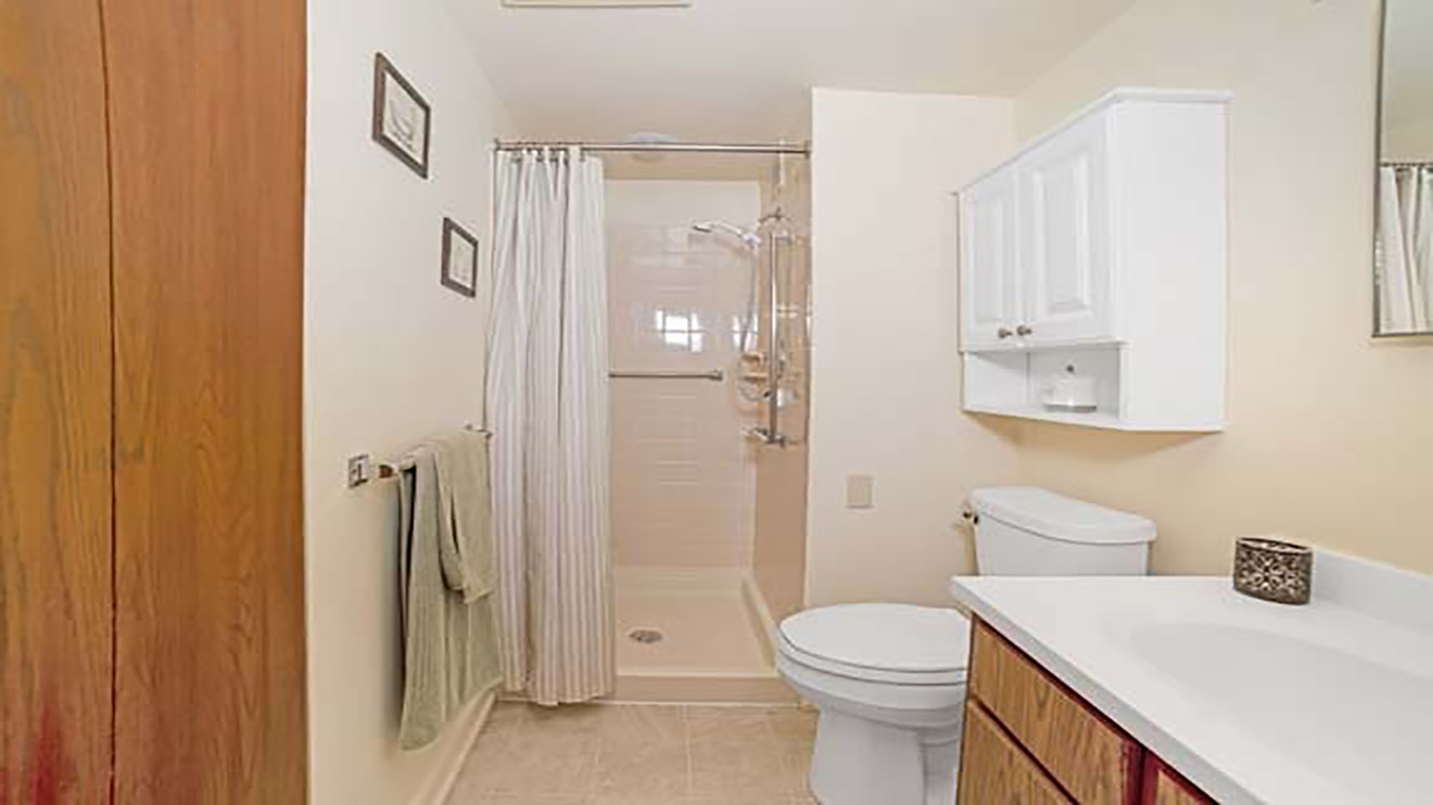 Holiday Winter Village apartment bathroom with walk in shower